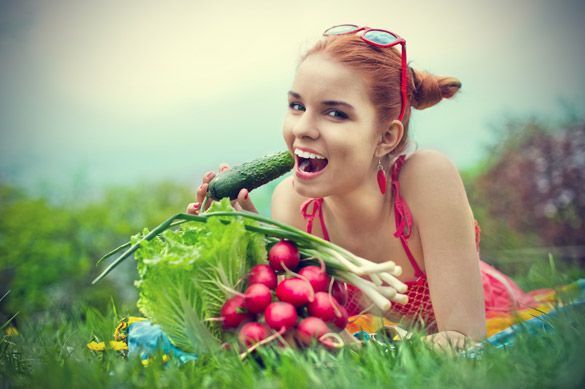 girl eating cucumber