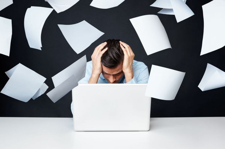 A-man-looks-frustrated-while-using-her-laptop-computer
