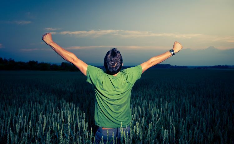 Young man enjoying his freedom/rejoicing from his success in the