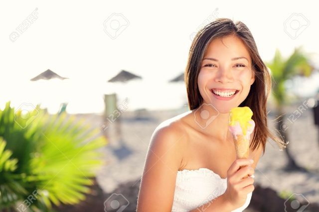 Woman eating ice cream outside