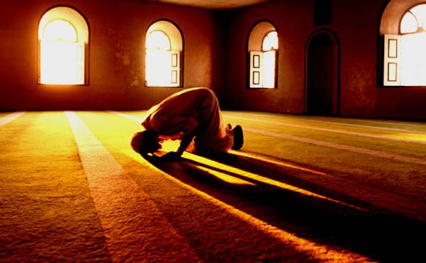 Muslim man prays in mosque