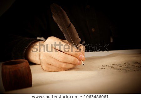 Writer Holds Fountain Pen Over Writing