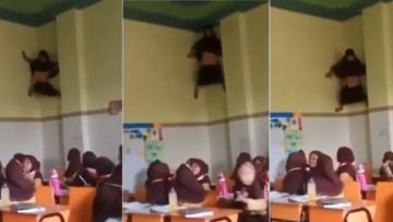 6 Hal yang Mungkin Jadi Alasan Gadis Viral ini Nemplok di Tembok Kelas. Hobi Manjat Apa Gimana sih?