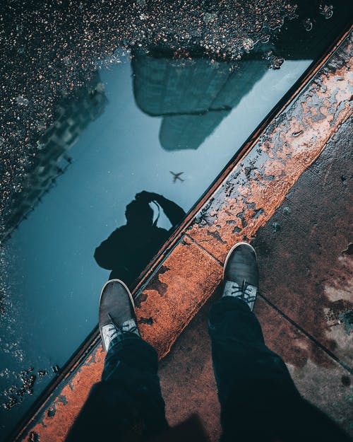 person standing on pavement
