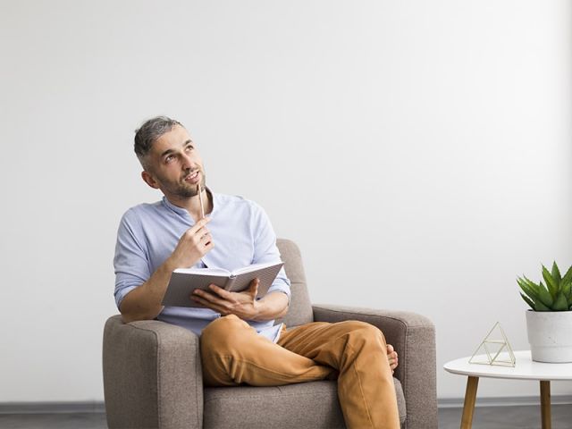 Dreamy man thinking about what to write