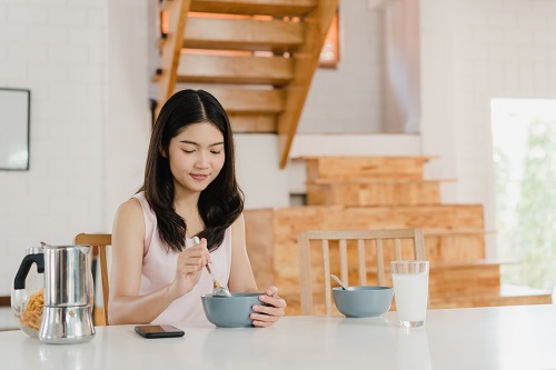 asian japanese woman has breakfast at home