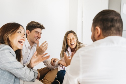 Multiracial group of friends laughing together via freepik