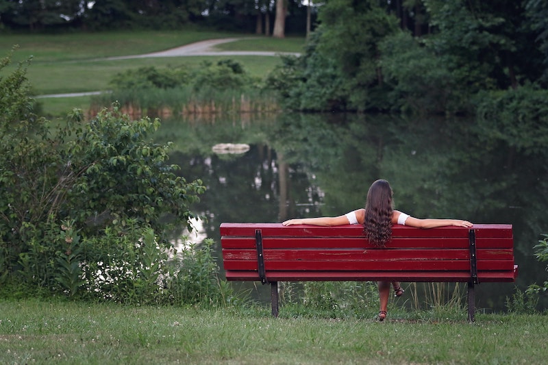 Woman Relaxing On Bench