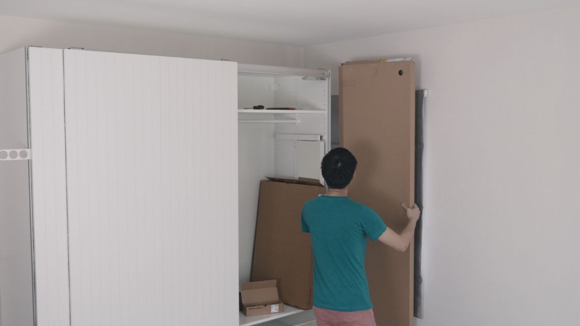 Designing Your First Room? Here Is How AI Floor Plan Makes It Way Less Stressful 8 Person arranging furniture in a small room.