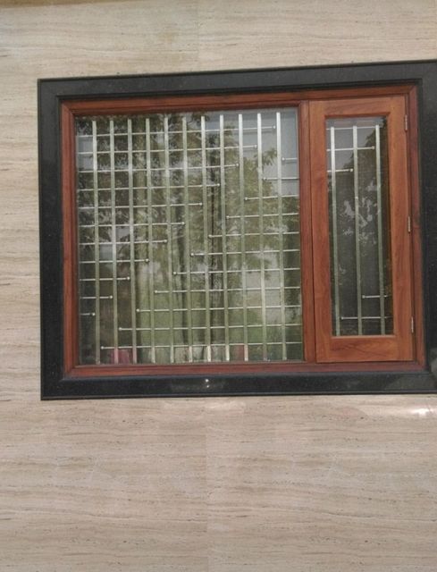 Inspirasi Model Teralis Jendela Minimalis untuk Fasad Hunian Modern 18 teralis kombinasi kayu dan besi