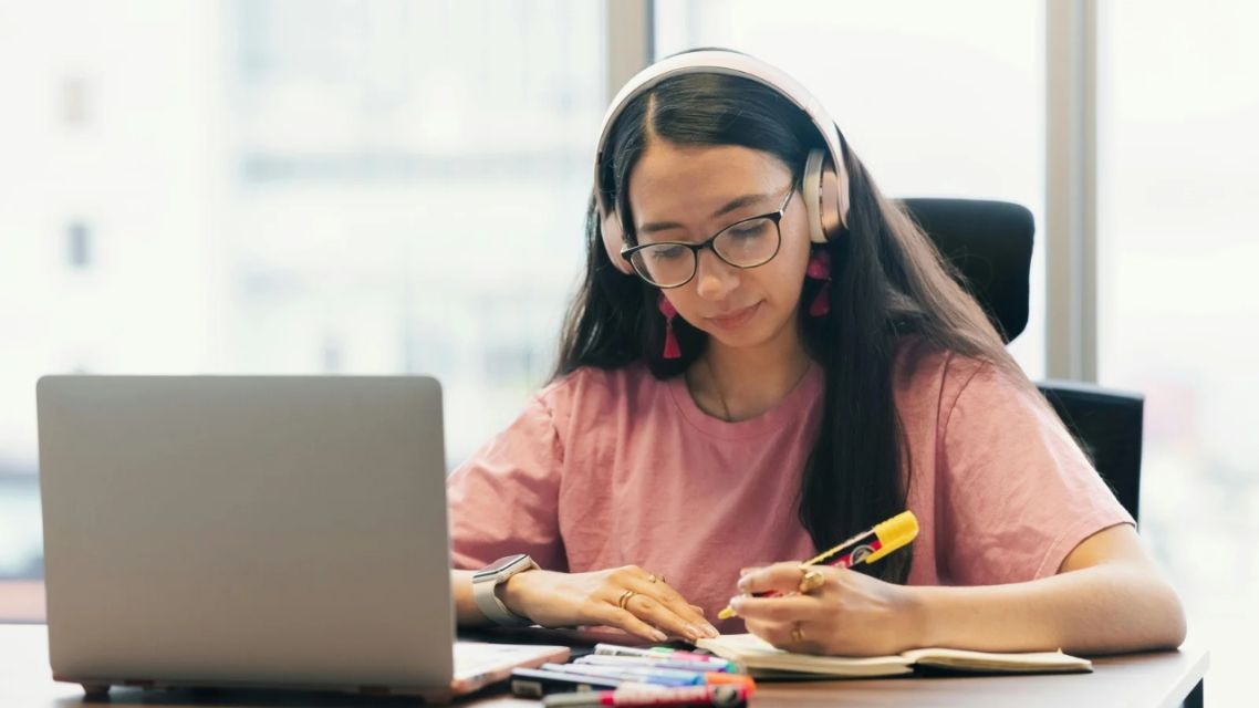 Mastering English Conditionals: Stop Memorizing and Start Using the Student practicing English conditionals with English grammar exercises on a laptop and notebook