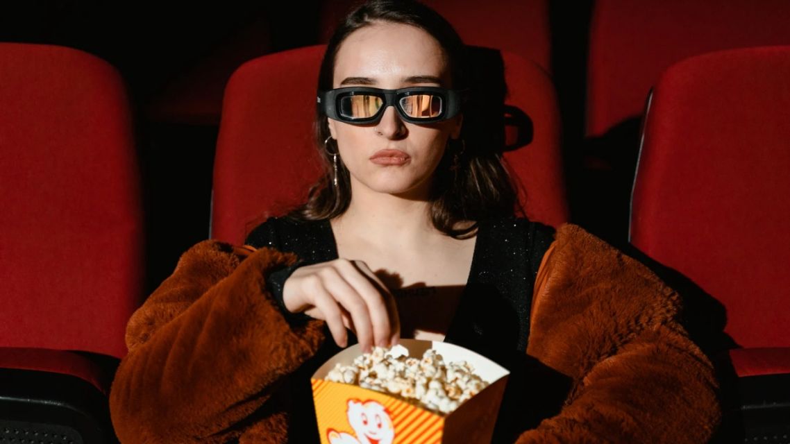 Why a Bad Movie Can Be the Best Way to Start Talking to Someone New 7 person watching bad movies alone at a cinema